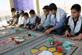 غبارروبی گلزار شهدای گمنام توسط کودکان