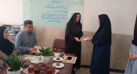تجلیل از خانواده شهید و جانفشانی کارکنان بهزیستی قصرشیرین در جنگ ۱۲روزه