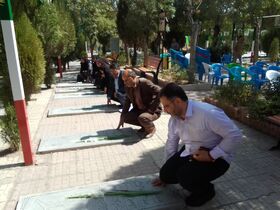 گلباران قبور مطهر شهدا توسط کارکنان کانون استان مرکزی